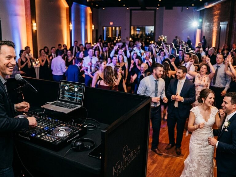 Professional Wedding DJ and Uplighting Setup at Reception Modern professional DJ setup with clean audio equipment and elegant warm uplighting at a wedding reception