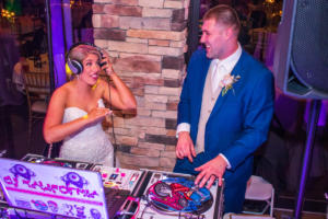 Davis Wedding | Rochester Wedding DJ | Ravenwood Country Club - bride and groom rockin out